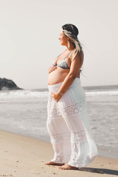 Photo by Wagner Camarini: https://www.pexels.com/photo/woman-in-white-and-pink-floral-dress-standing-on-beach-3639990/